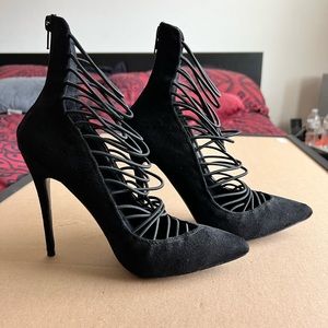 Pointed toe strappy pump.